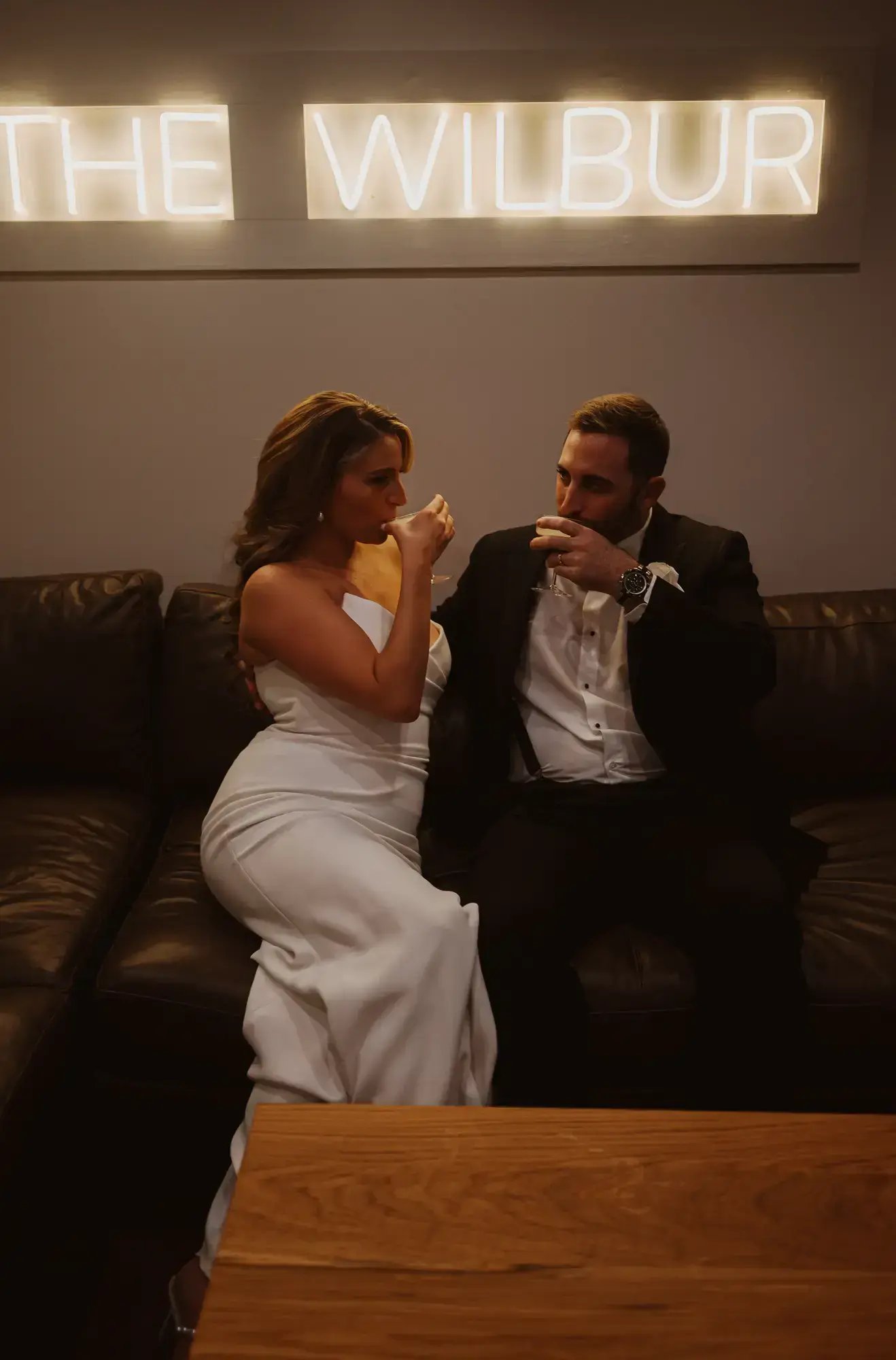 Bride and groom having drinks