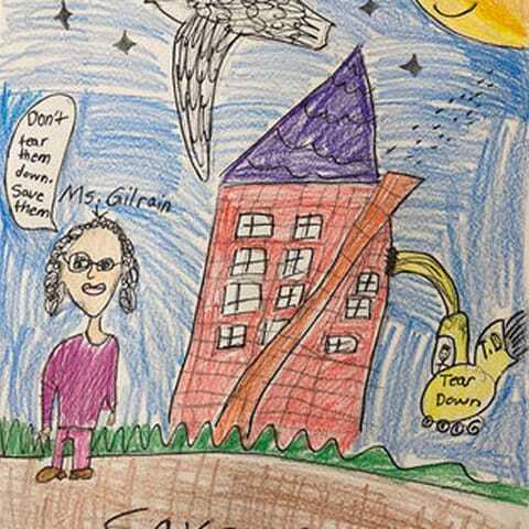 A colorful child’s drawing showing a person labeled “Ms. Gilrain,” a bird, and a red building with a speech bubble saying “Don’t tear them down, save them,” alongside a bulldozer marked “Tear Down.”