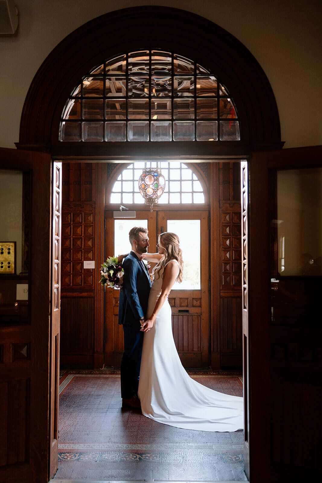 bride & groom in vestibule 3