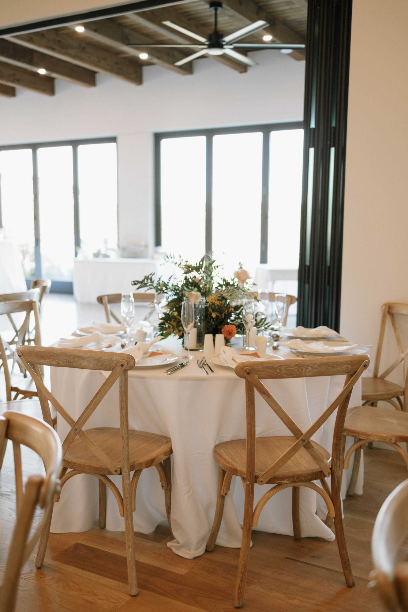 tables set with patio windows in back